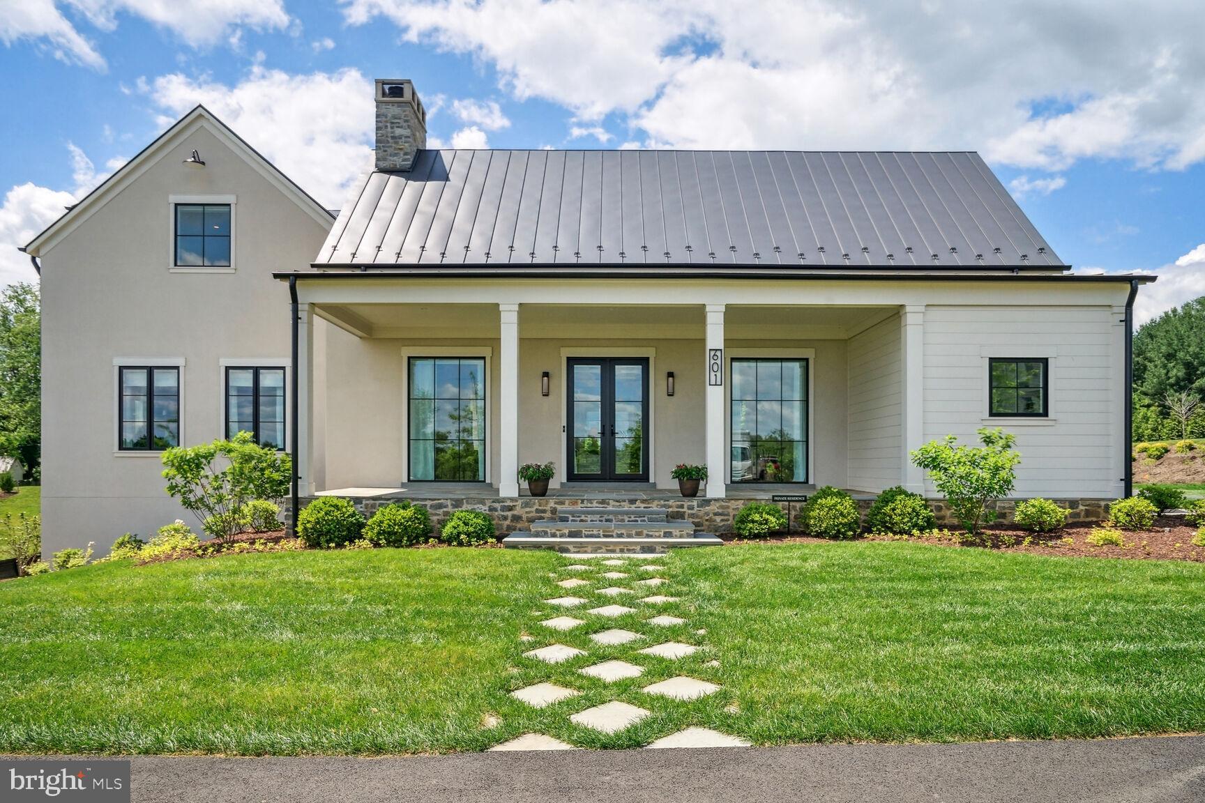 601 Martingale Ridge Drive Middleburg, VA 20117 - Photo 4 of 51 a front view of a house with garden and porch
