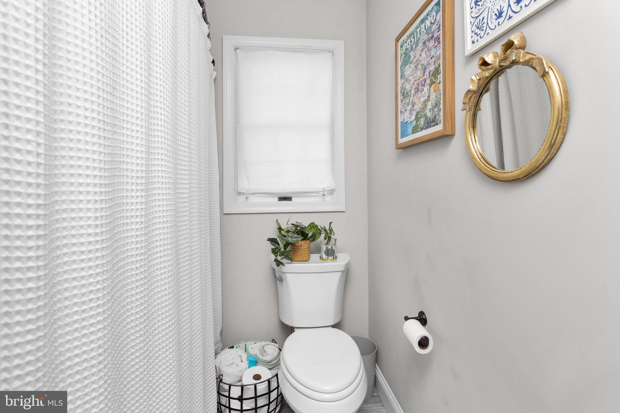 23 Brown Drive Hamilton, NJ 08690 - Photo 14 of 34 a white toilet sitting next to a bathroom sink
