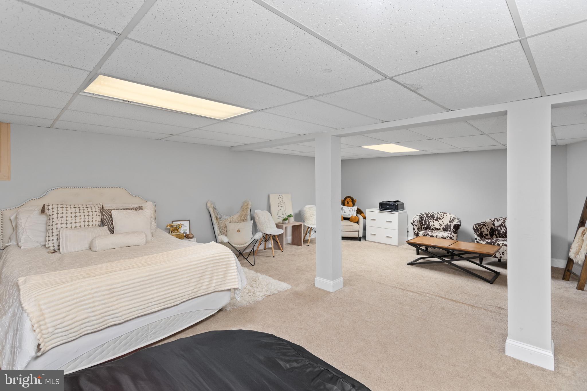 23 Brown Drive Hamilton, NJ 08690 - Photo 24 of 34 a bedroom with bed and a couch