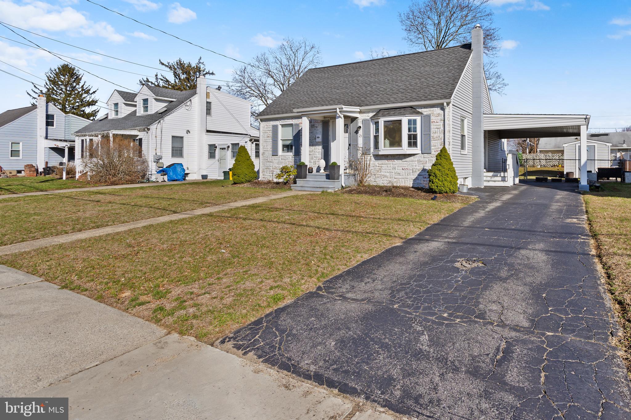 23 Brown Drive Hamilton, NJ 08690 - Photo 4 of 34 a front view of a house with a yard