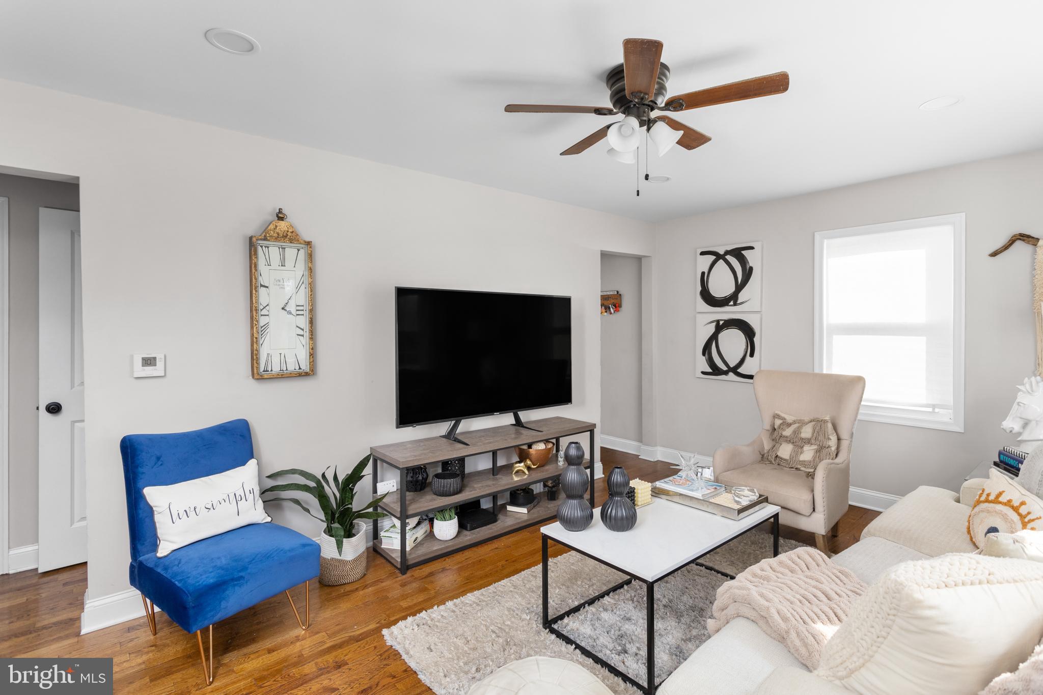 23 Brown Drive Hamilton, NJ 08690 - Photo 7 of 34 a living room with furniture and a flat screen tv