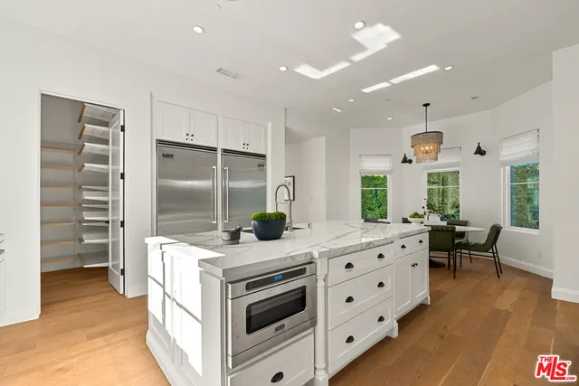 a bedroom with a bed and a mirror