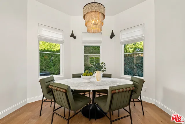 a bedroom with a bed and a night stand