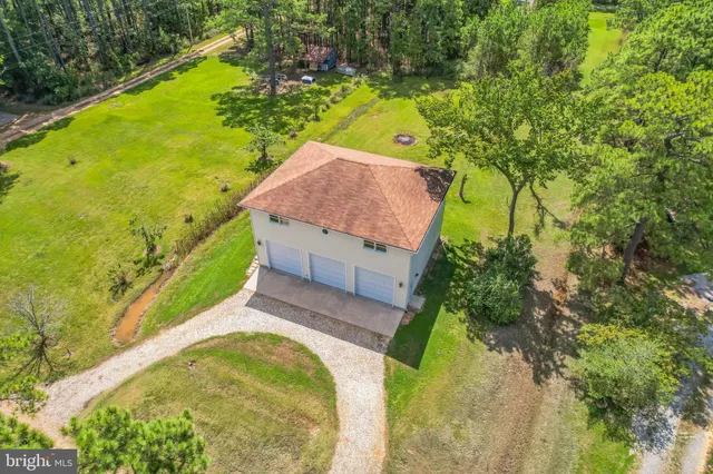 an aerial view of a house with a lake view
