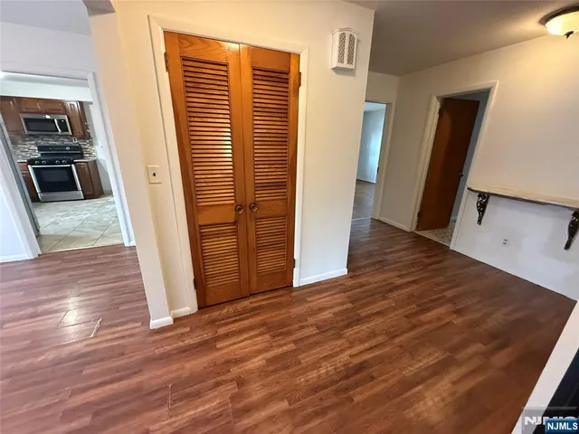 a view of a kitchen from the hallway