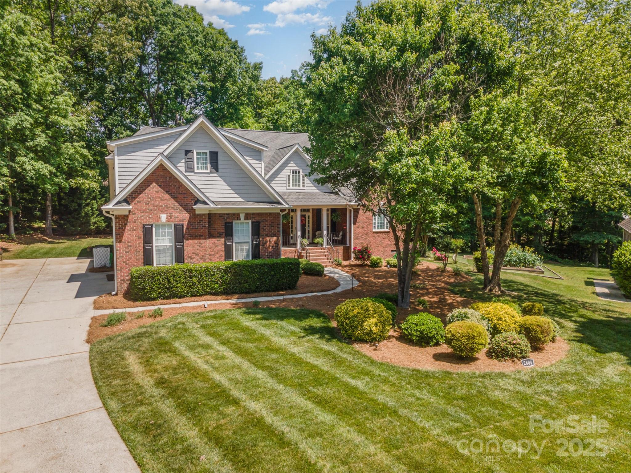 a view of a house with swimming pool and sitting area