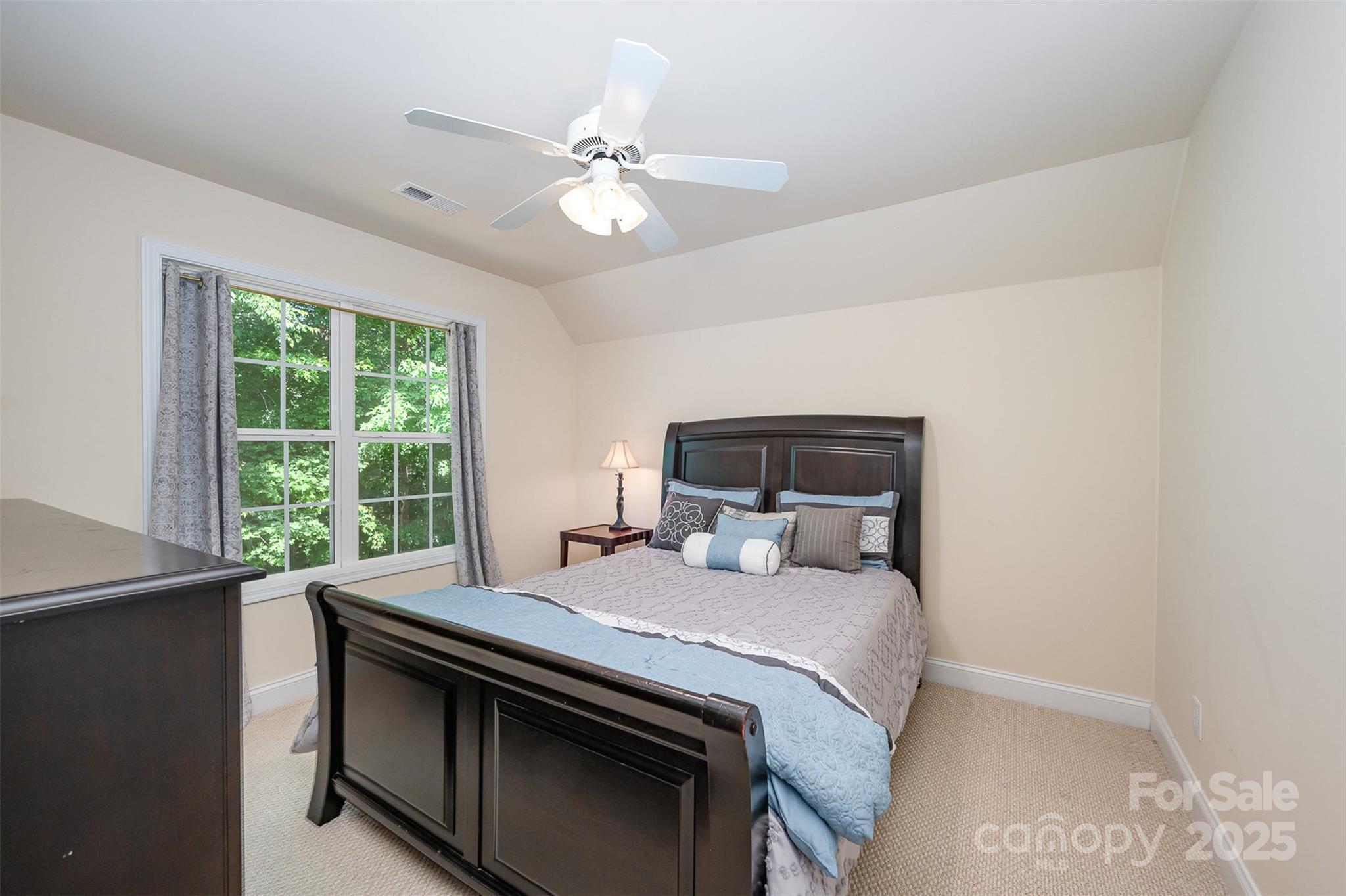 2804 Pulaski Drive Monroe, NC 28110 - Photo 22 of 30 a bedroom with a bed and a chandelier