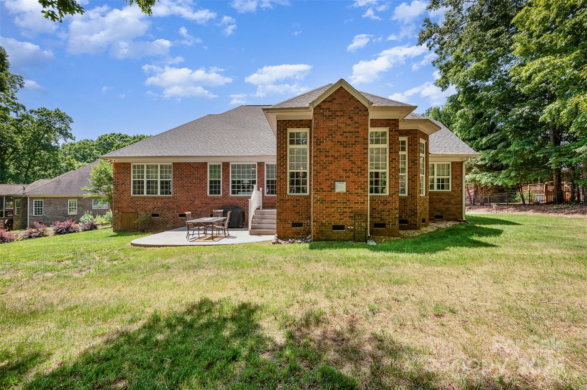 2804 Pulaski Drive Monroe, NC 28110 - Photo 26 of 30 a view of a house with a big yard plants and large trees