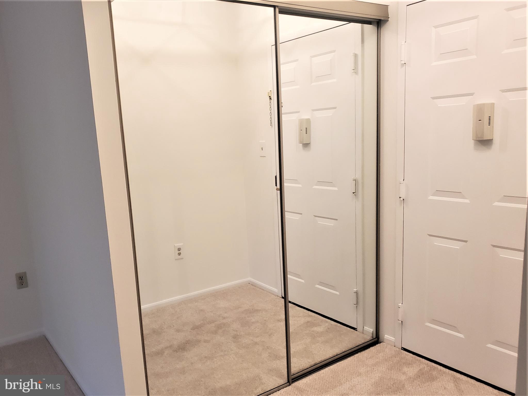 15100 Interlachen Drive, Unit 4516 Silver Spring, MD 20906 - Photo 9 of 28 Double Mirrored Foyer Closet