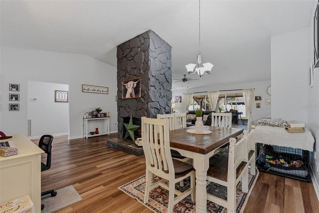 9062 Blackstone Street Spring Hill, FL 34608 - Photo 11 of 49 a view of a dining room with furniture and wooden floor