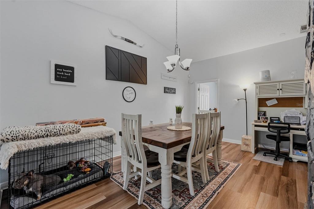 9062 Blackstone Street Spring Hill, FL 34608 - Photo 12 of 49 a view of a livingroom with furniture and a flat screen tv