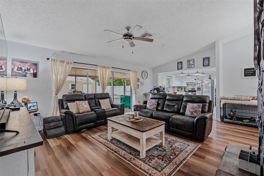 9062 Blackstone Street Spring Hill, FL 34608 - Photo 13 of 49 a living room with furniture and a wooden floor