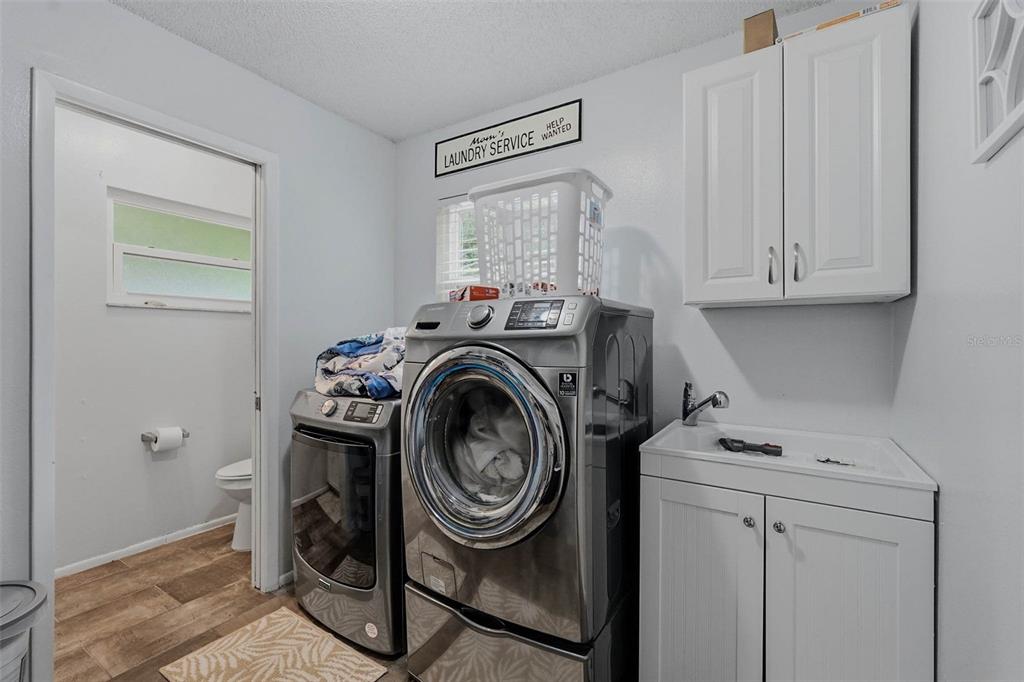 9062 Blackstone Street Spring Hill, FL 34608 - Photo 32 of 49 a utility room with dryer and washer