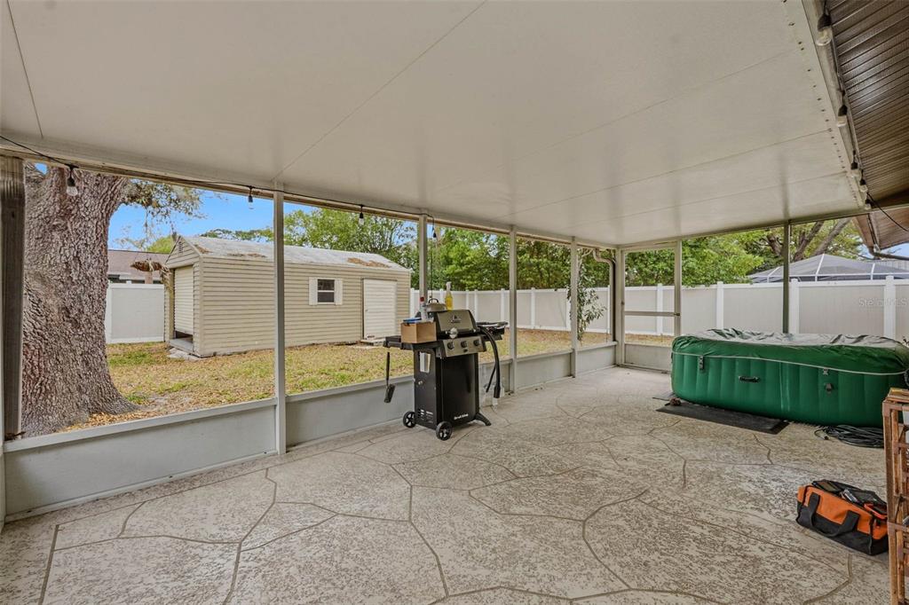 9062 Blackstone Street Spring Hill, FL 34608 - Photo 33 of 49 a view of a backyard with sitting area and furniture