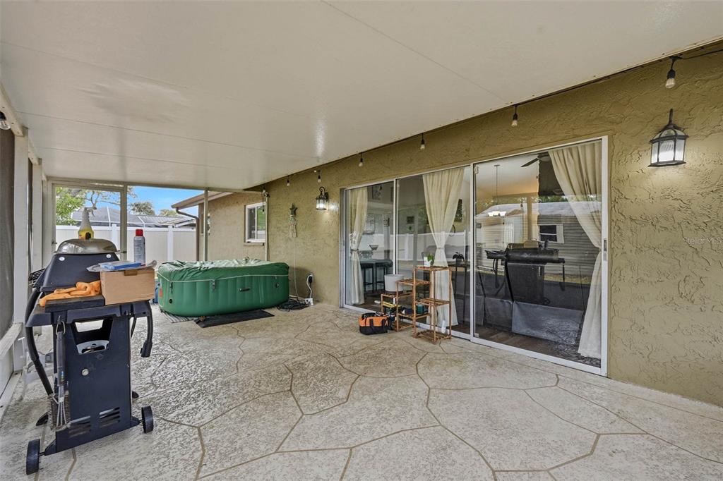 9062 Blackstone Street Spring Hill, FL 34608 - Photo 34 of 49 a view of a livingroom with furniture and a garage