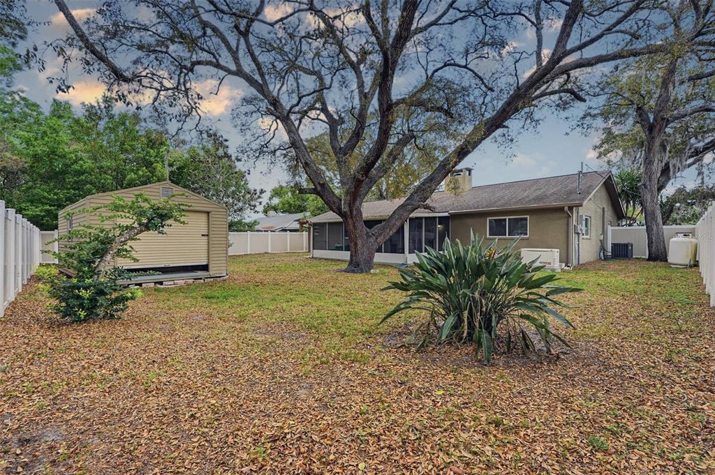 9062 Blackstone Street Spring Hill, FL 34608 - Photo 39 of 49 a front view of a house with garden