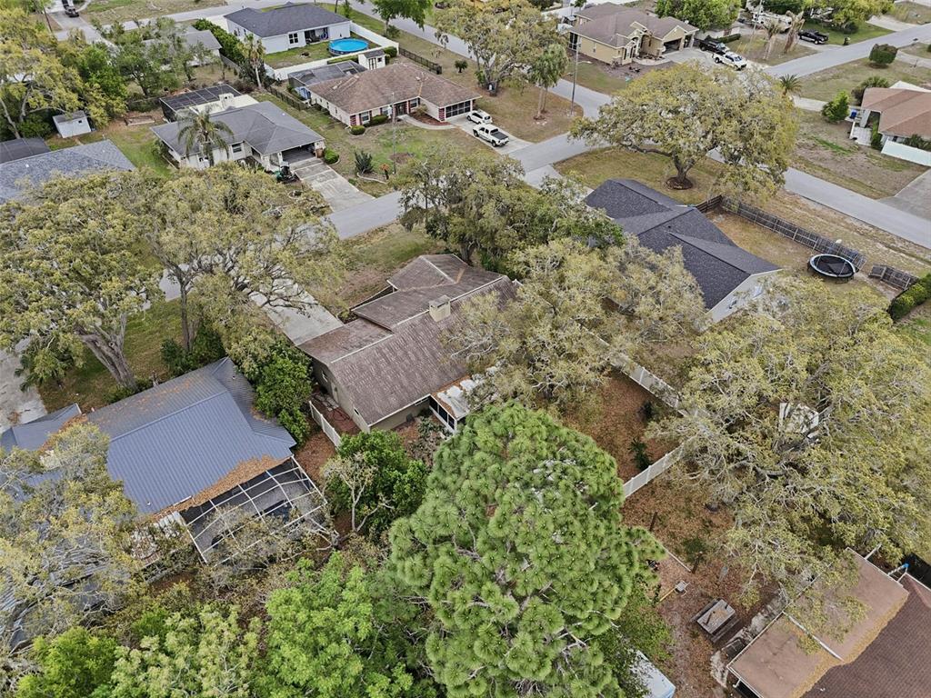 9062 Blackstone Street Spring Hill, FL 34608 - Photo 43 of 49 an aerial view of a house with a yard and outdoor seating
