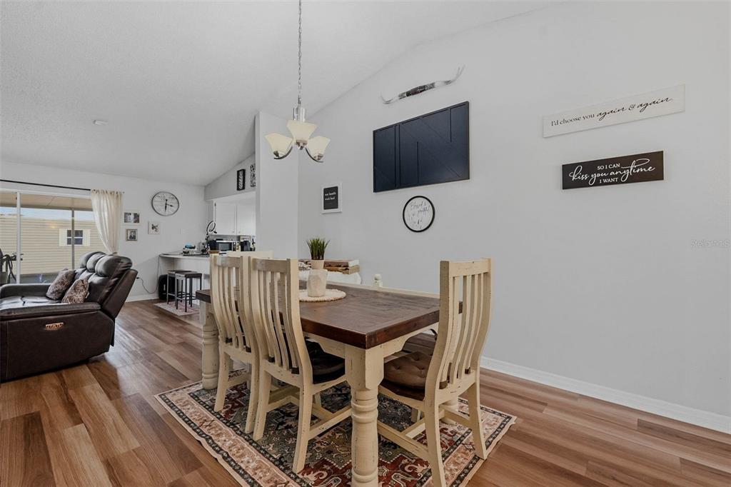 9062 Blackstone Street Spring Hill, FL 34608 - Photo 9 of 49 a view of a livingroom with furniture and a flat screen tv