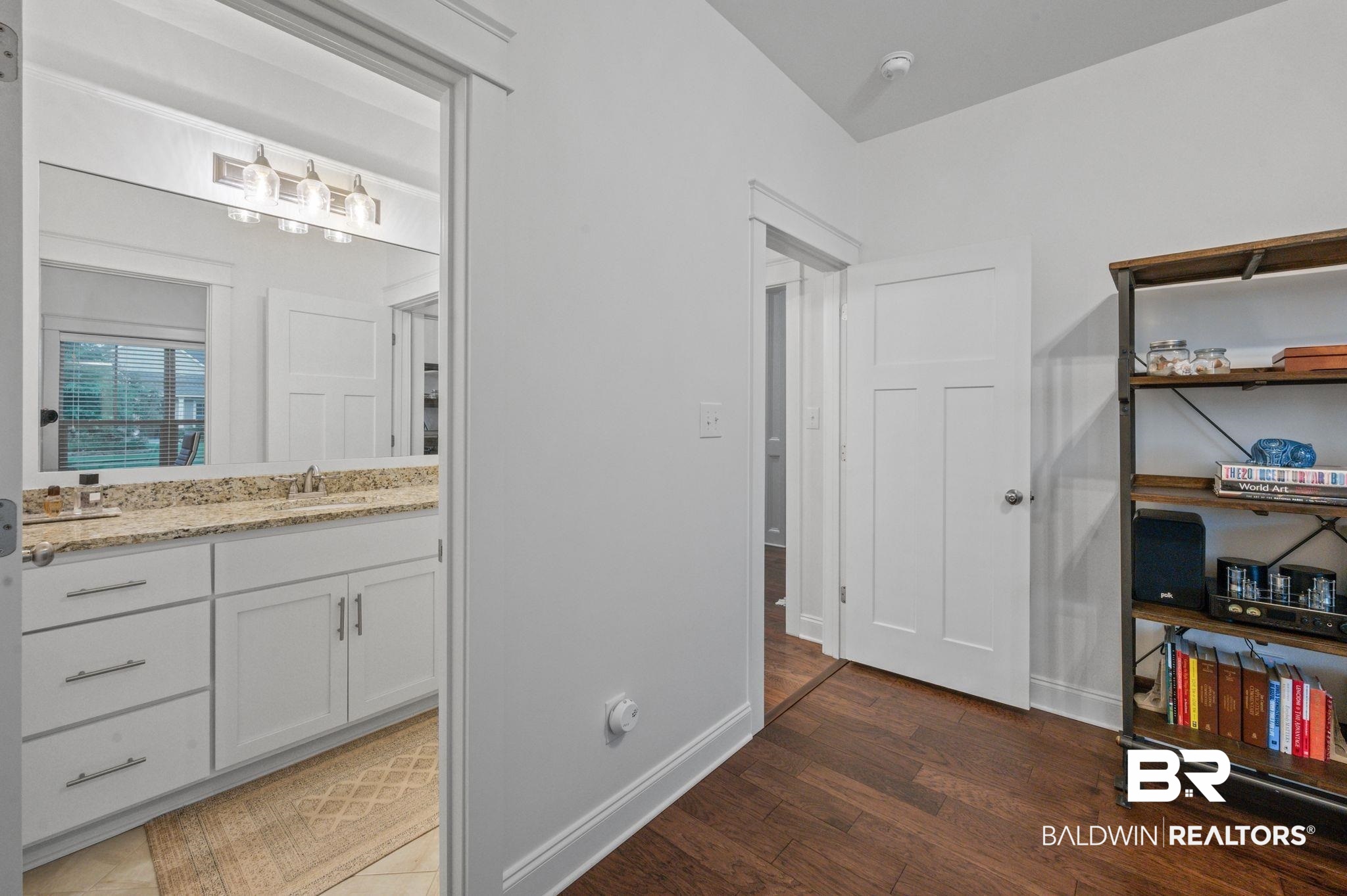 418 Fortune Drive Fairhope, AL 36532 - Photo 40 of 63 Bathroom featuring wood-type flooring and vanity