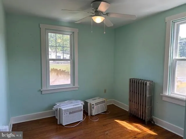 a room with a window and flowerpot