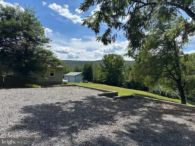 a view of outdoor space with playground and green space