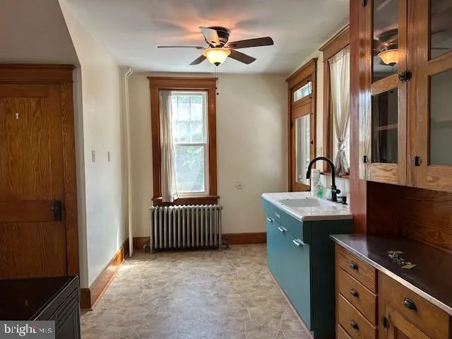a kitchen with stainless steel appliances a sink stove and cabinets