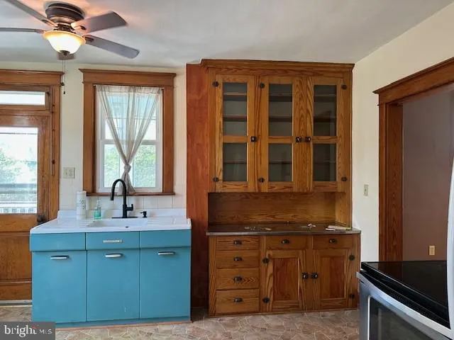 a kitchen with a sink and a window