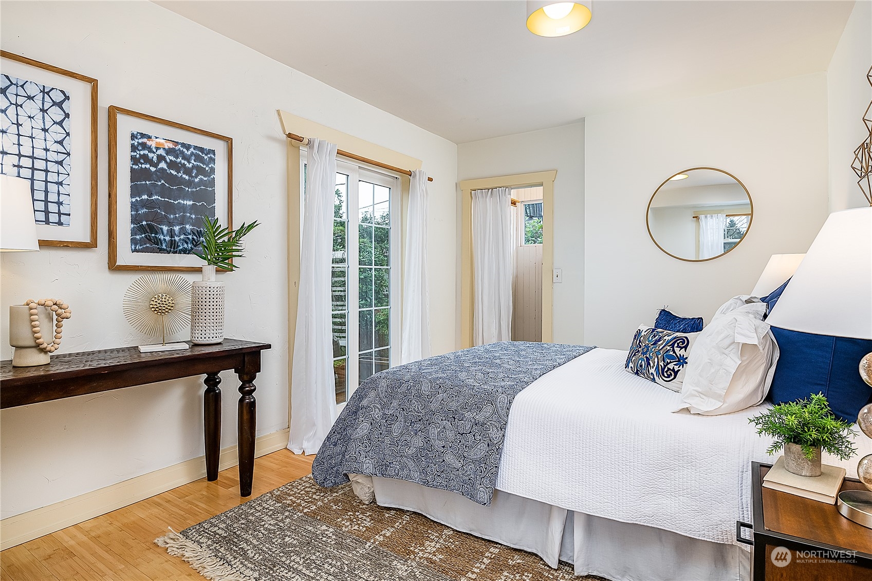 4100 Southwest Raymond Street Seattle, WA 98136 - Photo 12 of 23 a bedroom with bed and wooden floor
