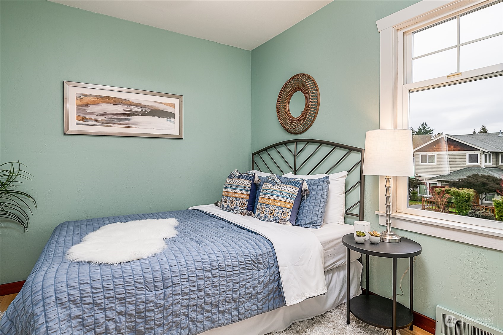 4100 Southwest Raymond Street Seattle, WA 98136 - Photo 13 of 23 a bedroom with a bed and window
