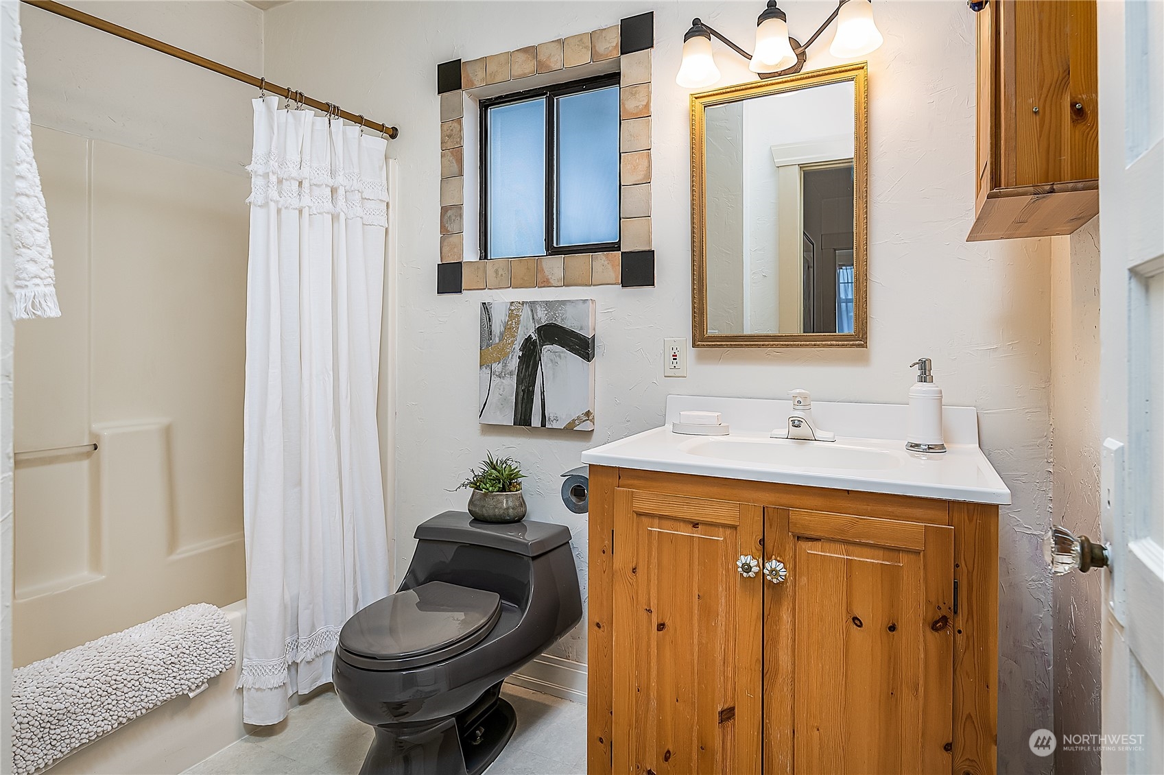 4100 Southwest Raymond Street Seattle, WA 98136 - Photo 14 of 23 a bathroom with a sink toilet and shower