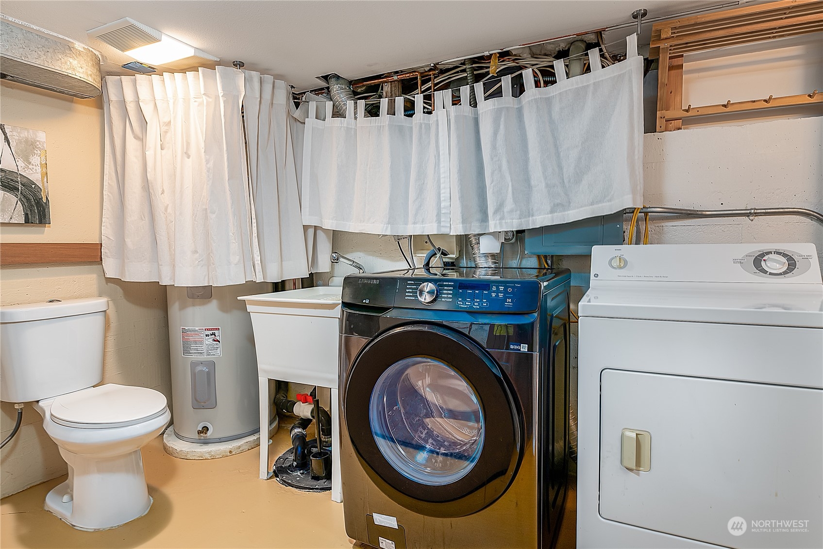4100 Southwest Raymond Street Seattle, WA 98136 - Photo 19 of 23 a utility room with dryer and washer