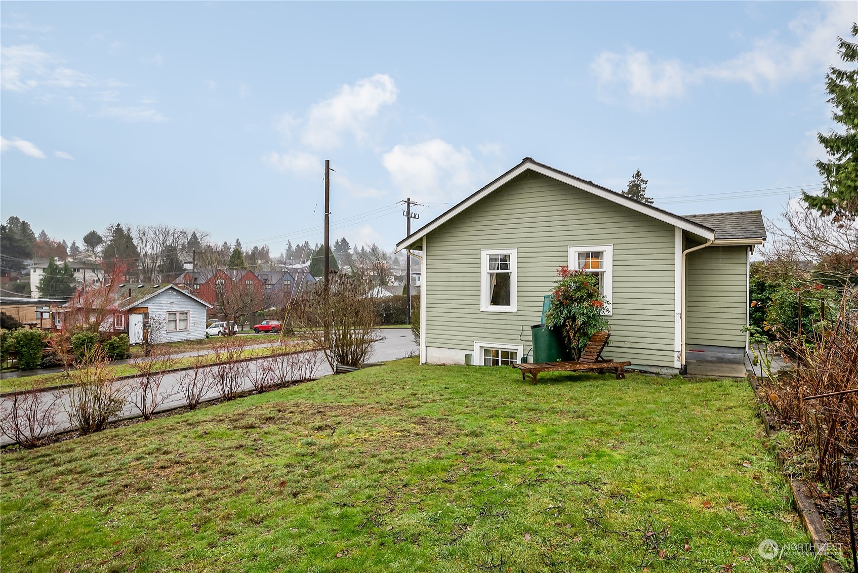 4100 Southwest Raymond Street Seattle, WA 98136 - Photo 2 of 23 a view of a house with a yard and plants