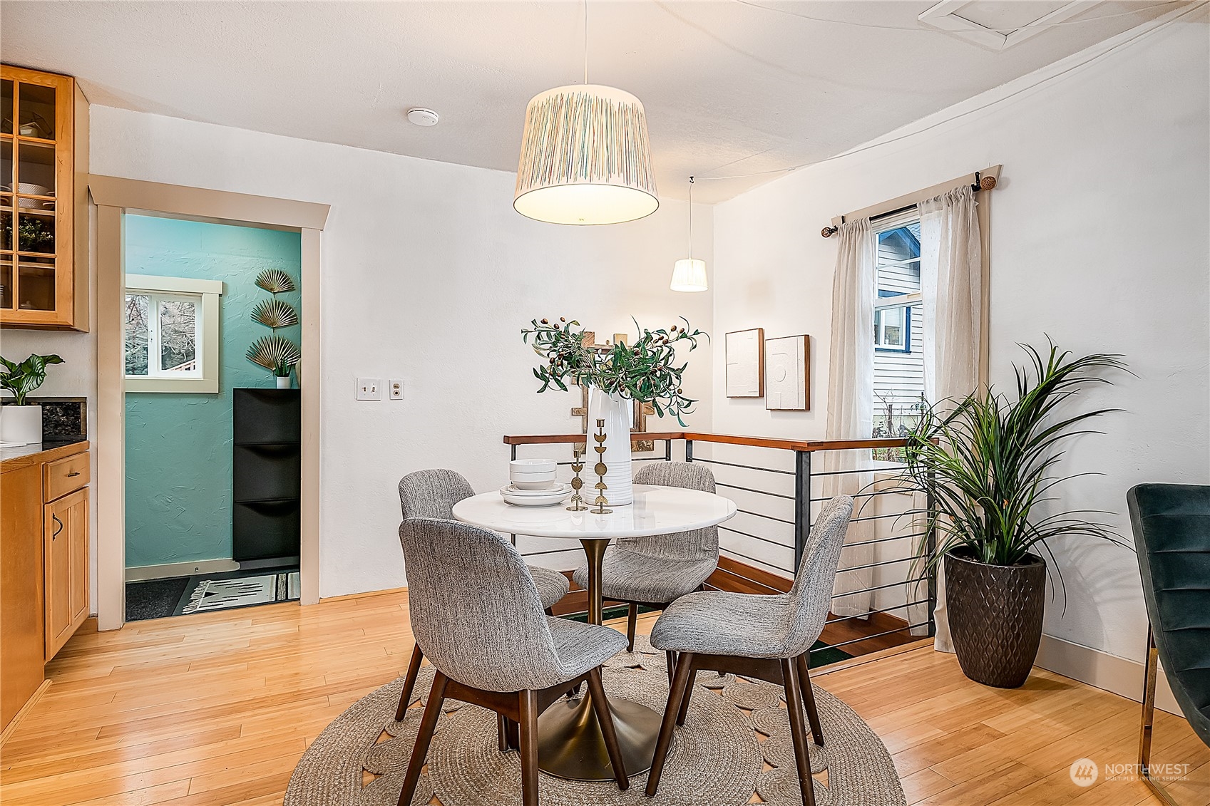4100 Southwest Raymond Street Seattle, WA 98136 - Photo 5 of 23 a dining room with furniture and wooden floor