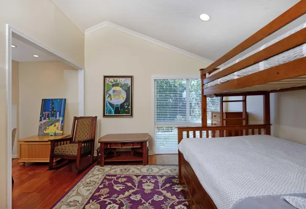 a bedroom with furniture and a window