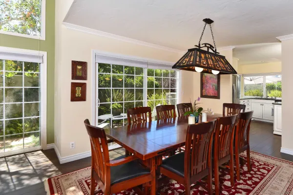 a view of a dining room with furniture window and outside view