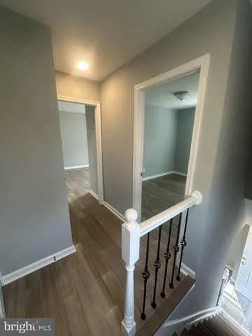a view of entryway with wooden floor