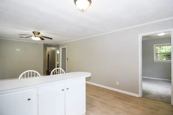 a view of a chandelier fan and entryway