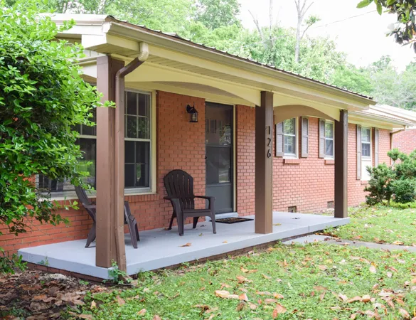 a view of backyard with a barbeque grill and plants