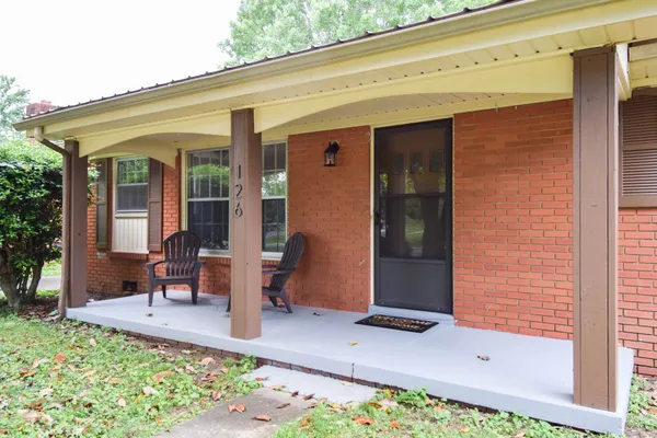 a front view of a house with patio