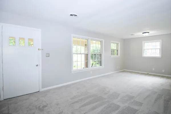 a view of an empty room with a window