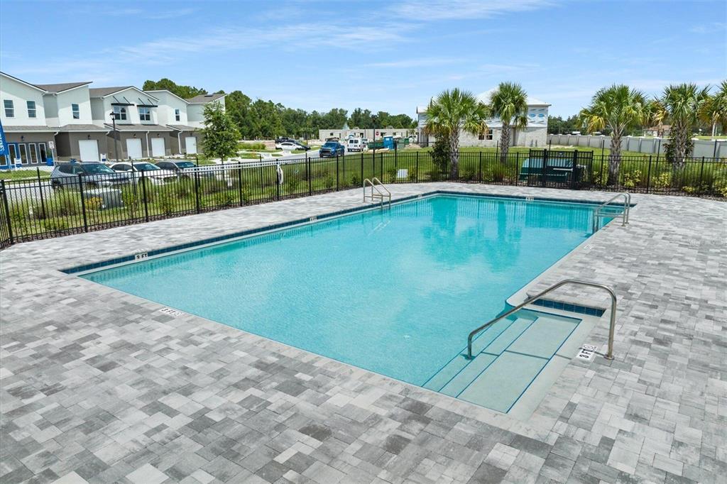 987 Spring Palms Loop Orlando, FL 32828 - Photo 9 of 22 a view of a lake with a houses