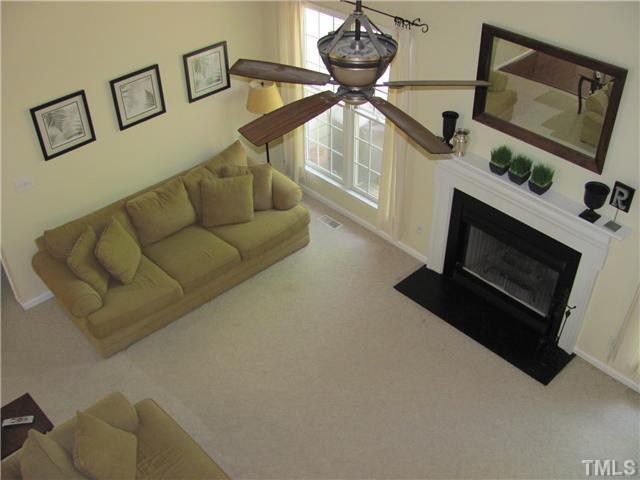 12224 Breton Lane Raleigh, NC 27613 - Photo 11 of 25 a living room with furniture and a flat screen tv