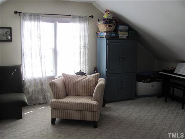 12224 Breton Lane Raleigh, NC 27613 - Photo 19 of 25 a living room with furniture and a window
