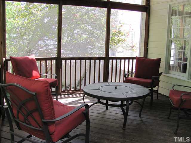 12224 Breton Lane Raleigh, NC 27613 - Photo 20 of 25 a view of a dining room with furniture window and wooden floor