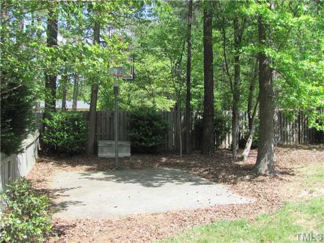 12224 Breton Lane Raleigh, NC 27613 - Photo 23 of 25 a backyard of a house with lots of green space