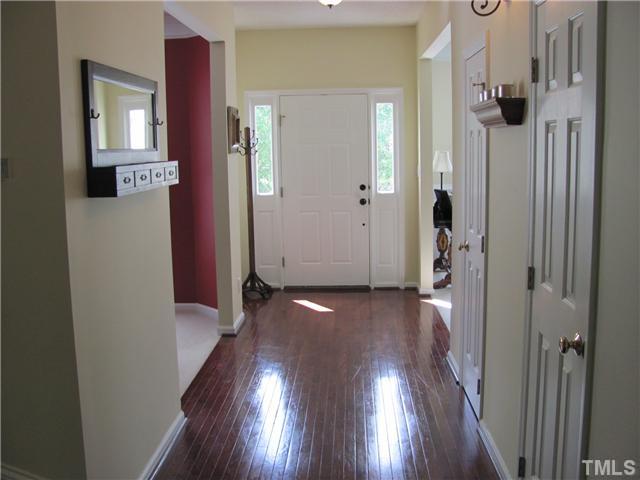 12224 Breton Lane Raleigh, NC 27613 - Photo 3 of 25 a view of gallery with wooden floor