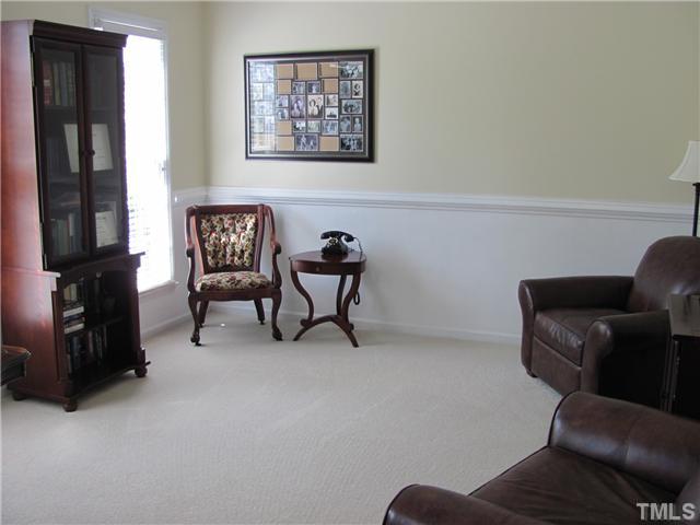 12224 Breton Lane Raleigh, NC 27613 - Photo 4 of 25 a living room with furniture and a closet