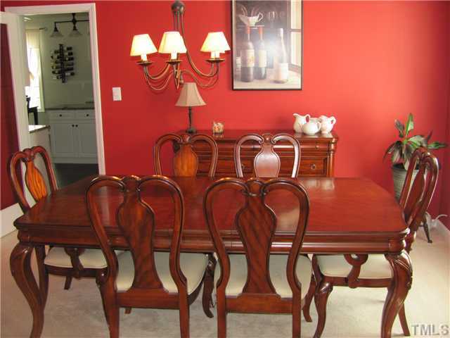 12224 Breton Lane Raleigh, NC 27613 - Photo 5 of 25 a dining room with furniture and wooden floor
