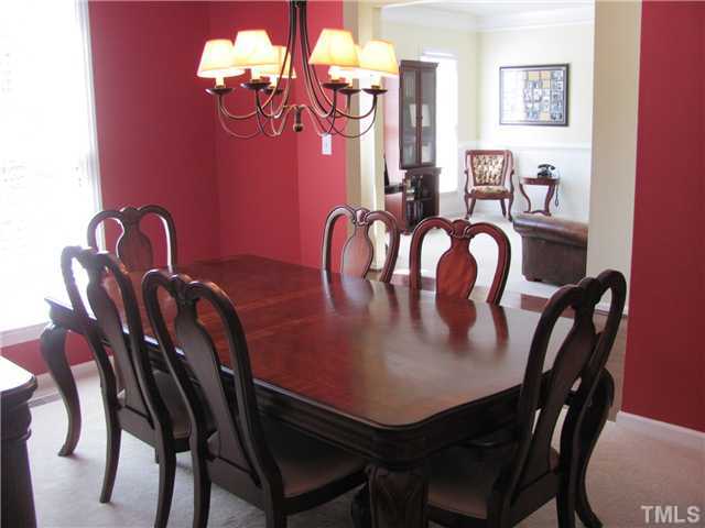 12224 Breton Lane Raleigh, NC 27613 - Photo 6 of 25 a view of a dining room with furniture