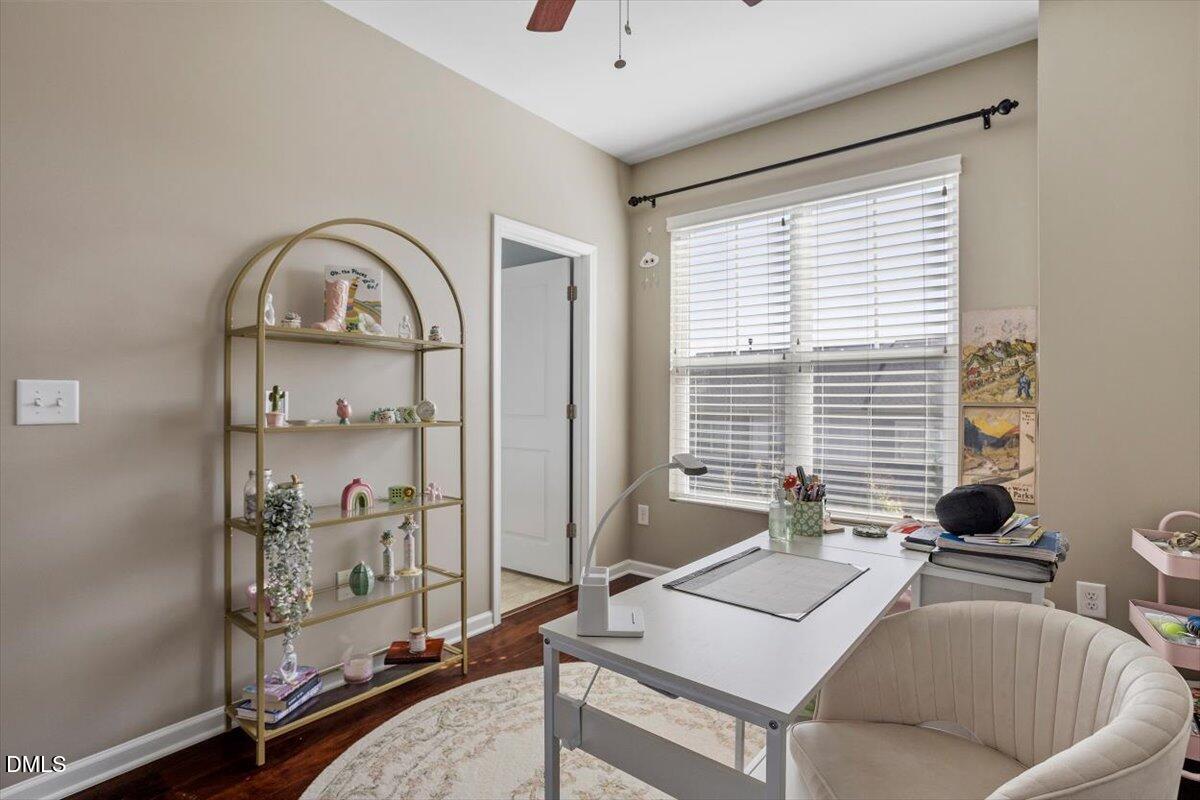 1427 Crafton Way Raleigh, NC 27607 - Photo 16 of 26 a living room with furniture and a window